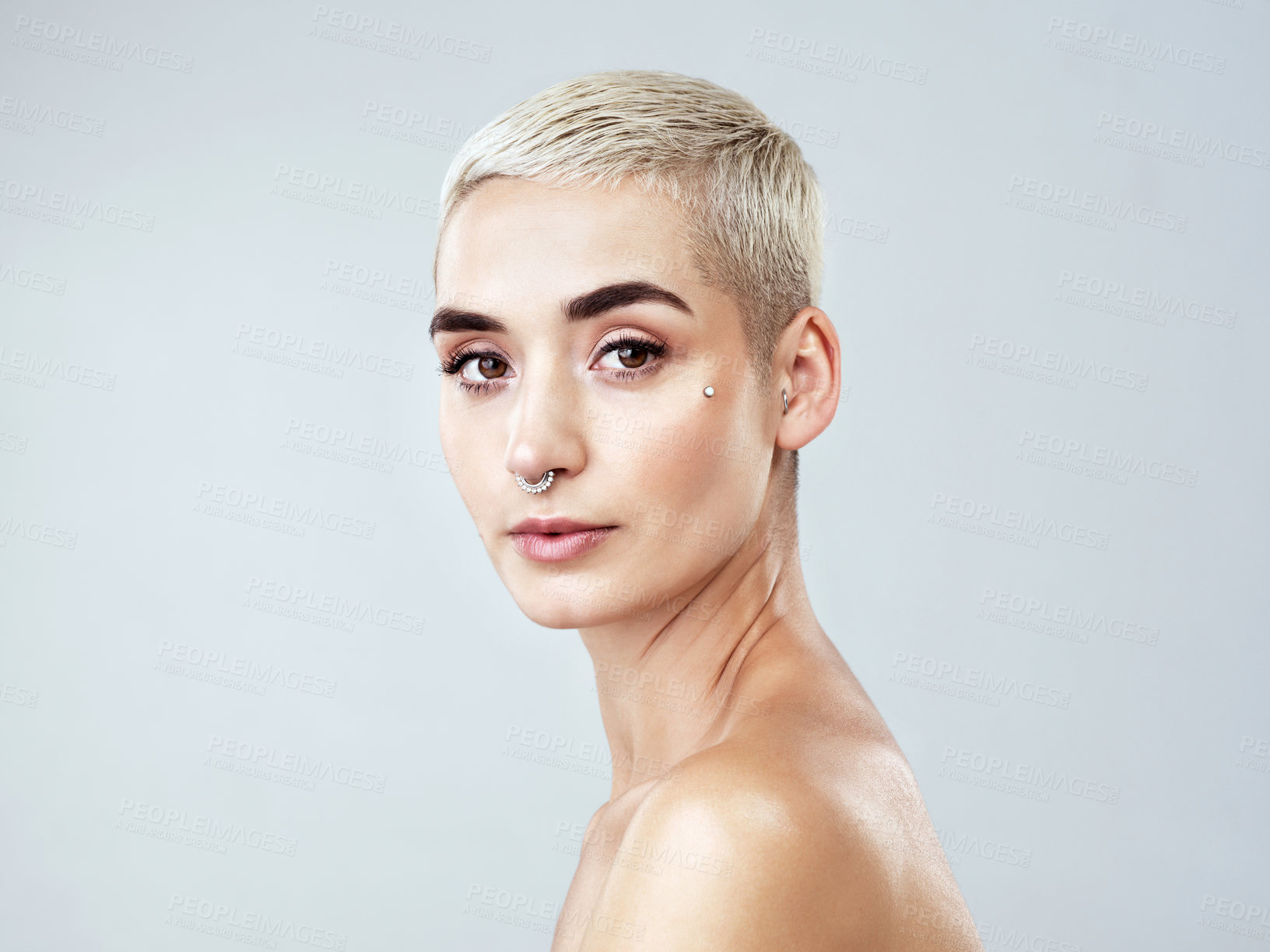 Buy stock photo Woman, portrait and beauty in studio for skincare, dermatology and cosmetics on white background. Female person, confidence and aesthetic for healthy skin, facial glow and self care with piercings