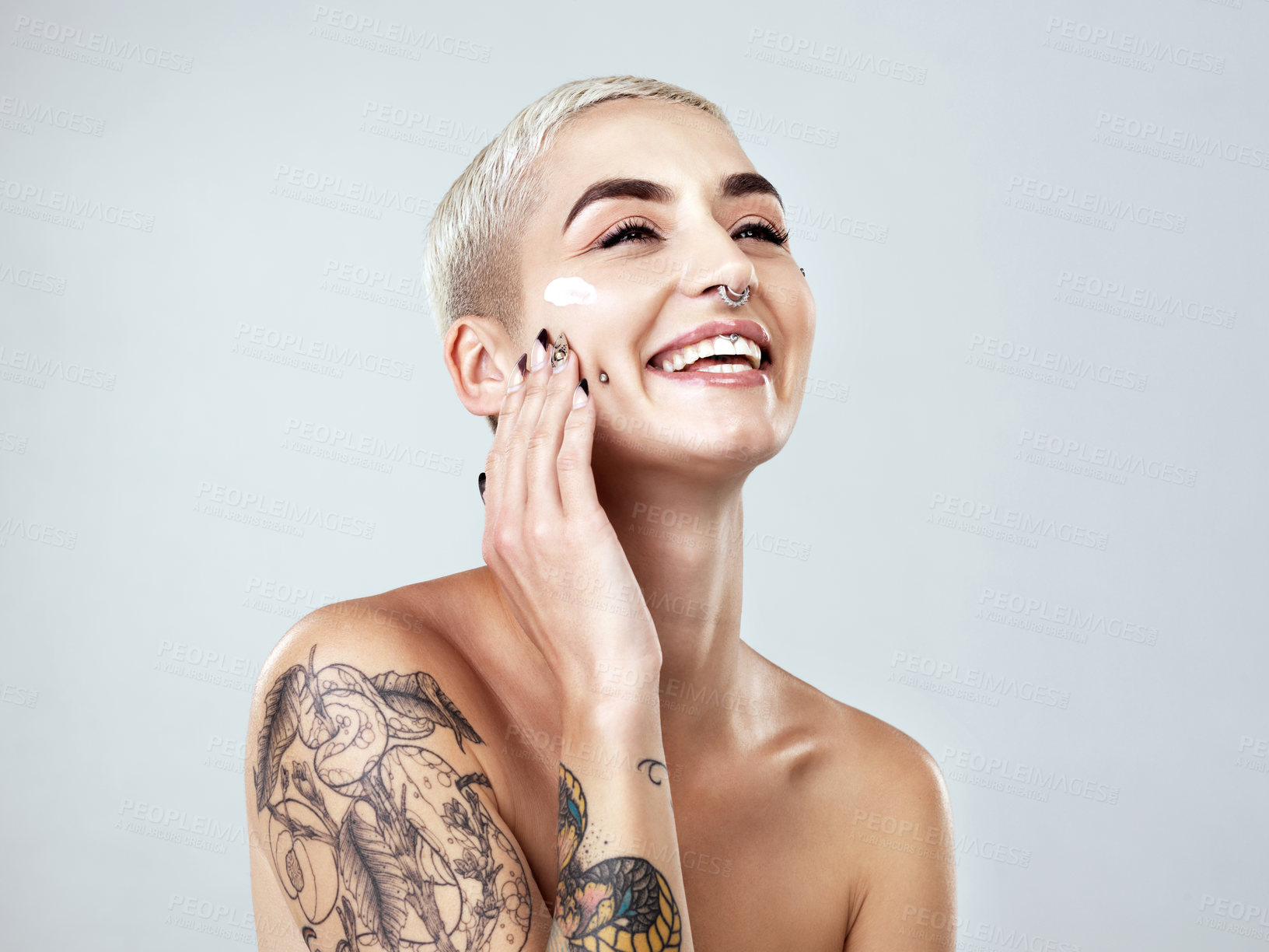 Buy stock photo Studio shot of a beautiful young woman posing against a grey background