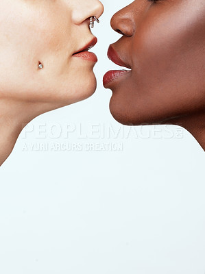 Buy stock photo Studio shot of two beautiful young women against a grey background