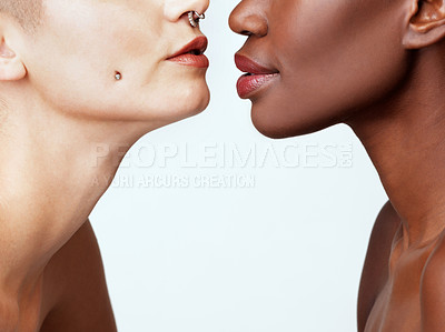 Buy stock photo Studio shot of two beautiful young women against a grey background