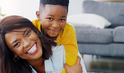 Buy stock photo Portrait of a young mother bonding and spending time with her adorable little boy at home