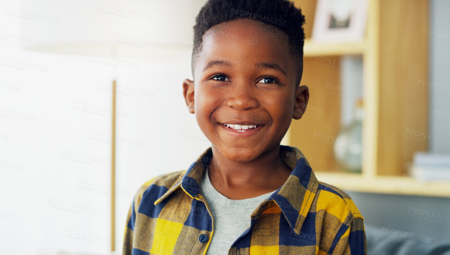 Buy stock photo Portrait of an adorable little boy smiling and feeling cheerful at home