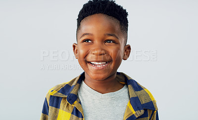 Buy stock photo Shot of an adorable little boy posing against a white background