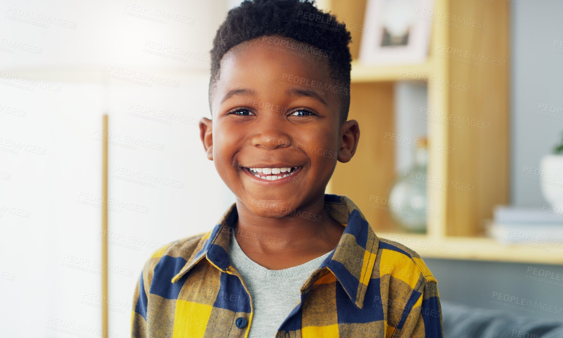 Buy stock photo Portrait of an adorable little boy smiling and feeling cheerful at home