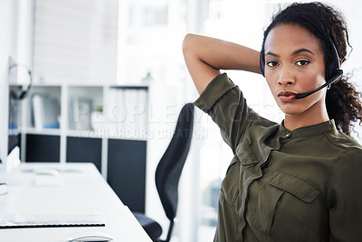 Buy stock photo Shot of a young woman using a headset in a modern office