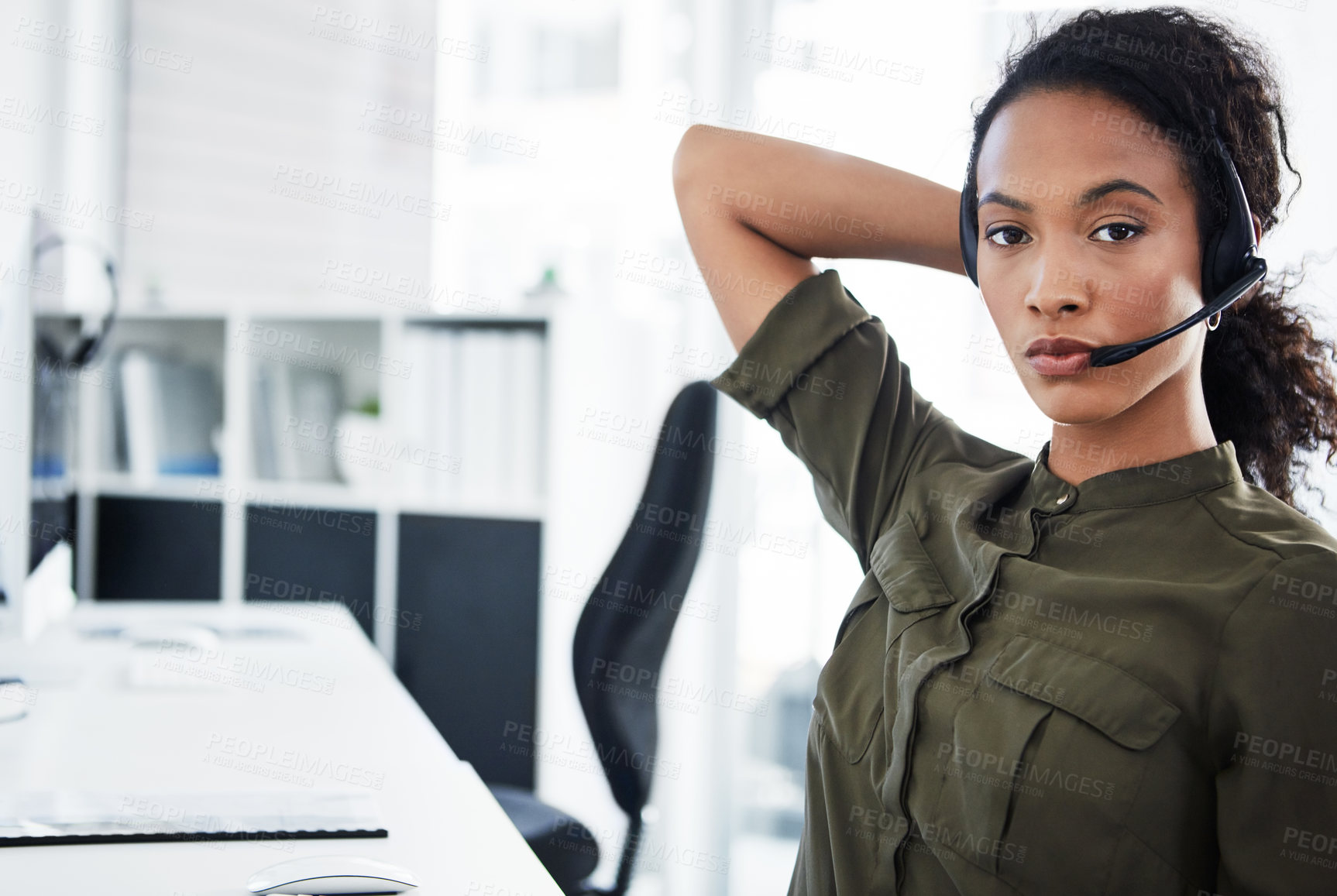 Buy stock photo Shot of a young woman using a headset in a modern office