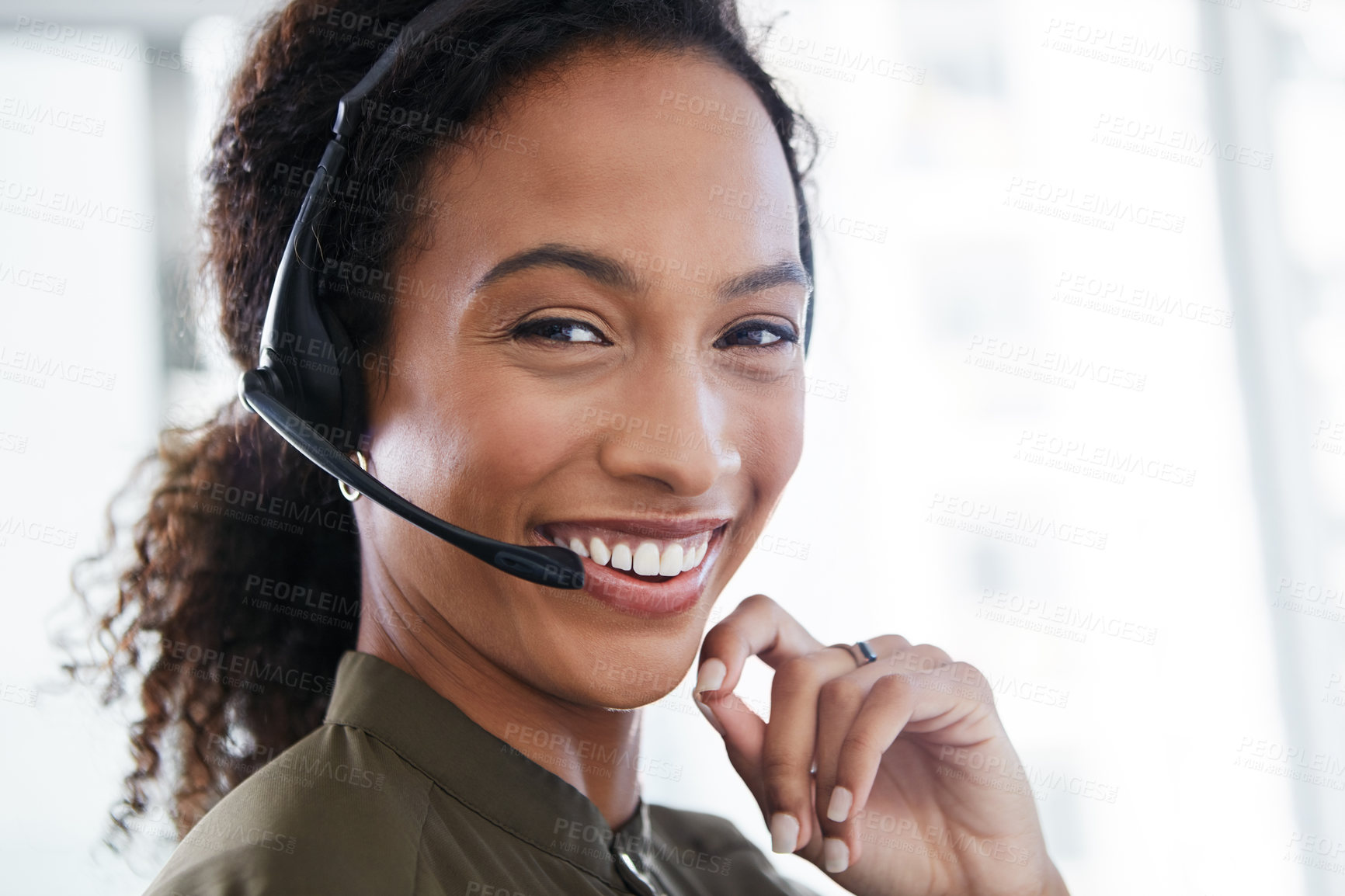 Buy stock photo Shot of a young woman using a headset in a modern office