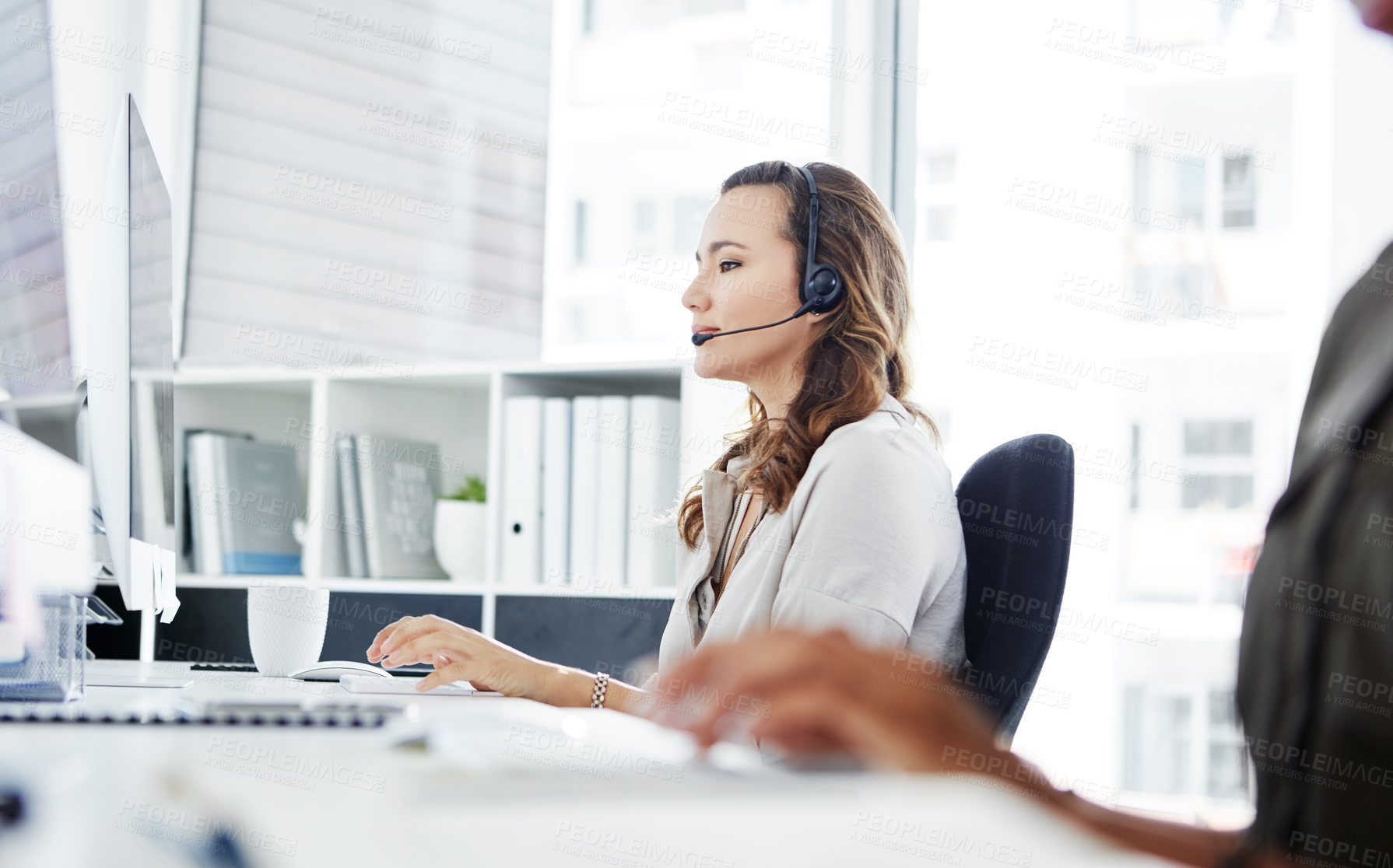 Buy stock photo Woman, thinking or talk in call center for customer service, telemarketing or problem solving in office. Female consultant, advice or tech at desk for help, communication or technical support in city