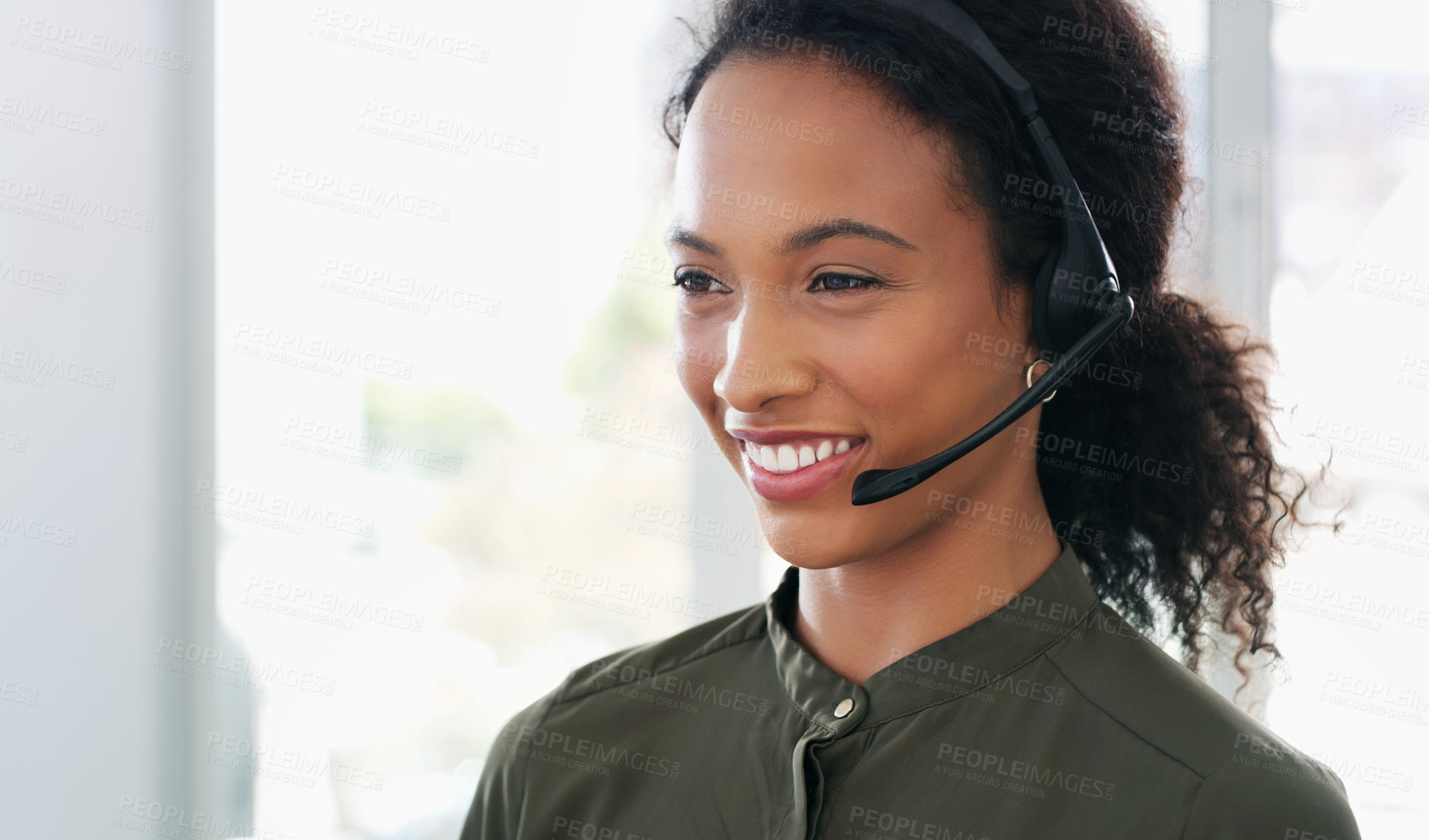 Buy stock photo Shot of a young woman using a headset in a modern office