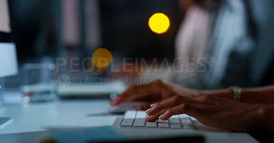 Buy stock photo Cropped shot of an unrecognizable businesswoman working late at night in the office