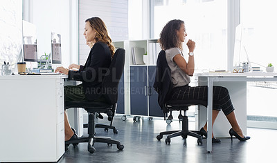Buy stock photo Shot of a young businesswoman celebrating an achievement in a modern office