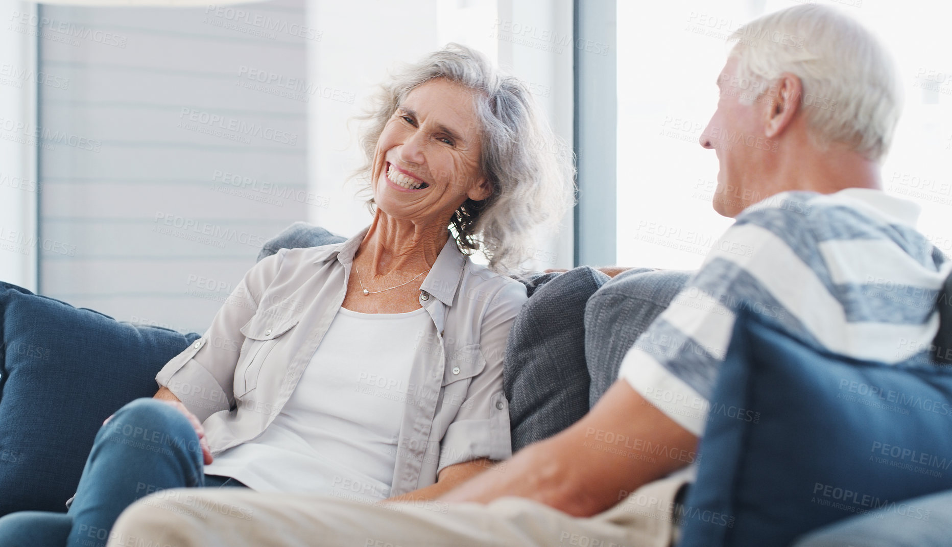 Buy stock photo Shot of a senior couple relaxing on the sofa at home