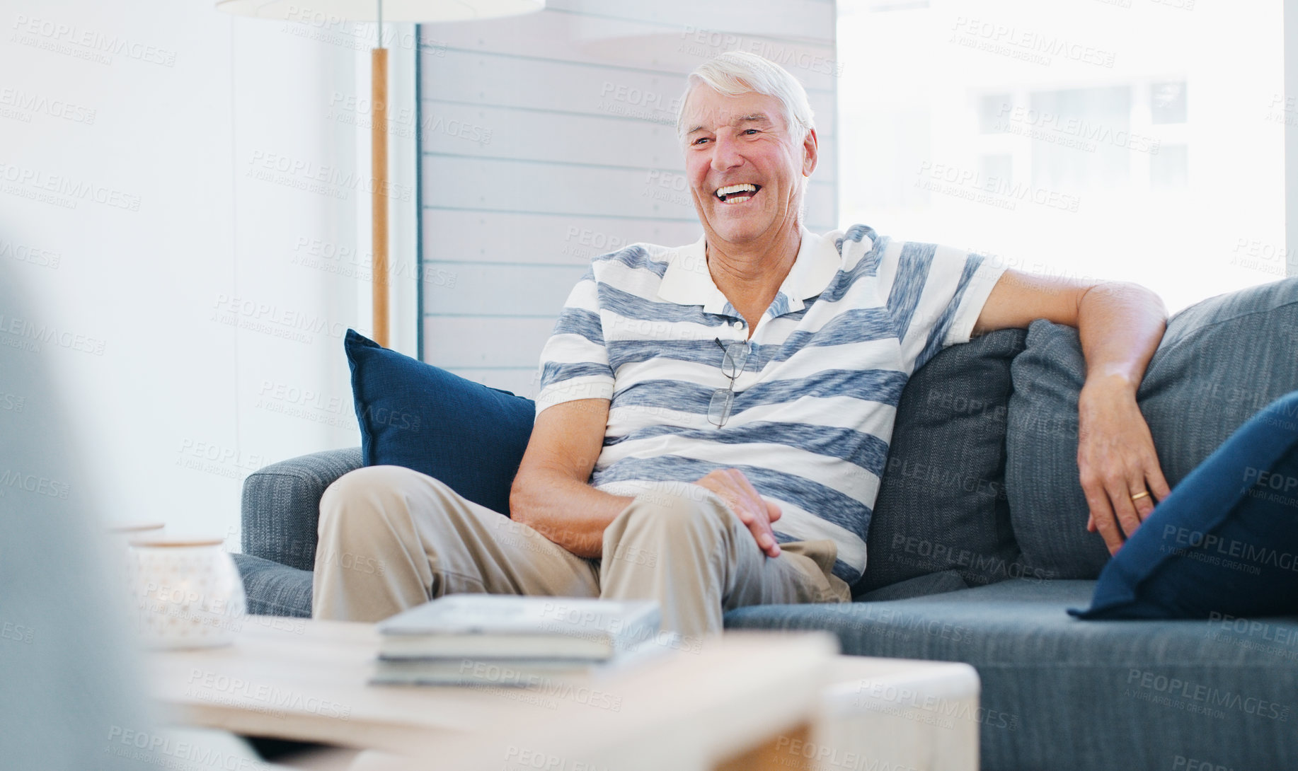 Buy stock photo Shot of a senior man relaxing on the sofa at home