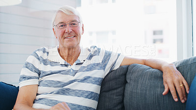 Buy stock photo Shot of a senior man relaxing on the sofa at home