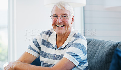 Buy stock photo Shot of a senior man relaxing on the sofa at home