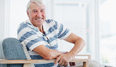 Buy stock photo Shot of a senior man relaxing on the sofa at home