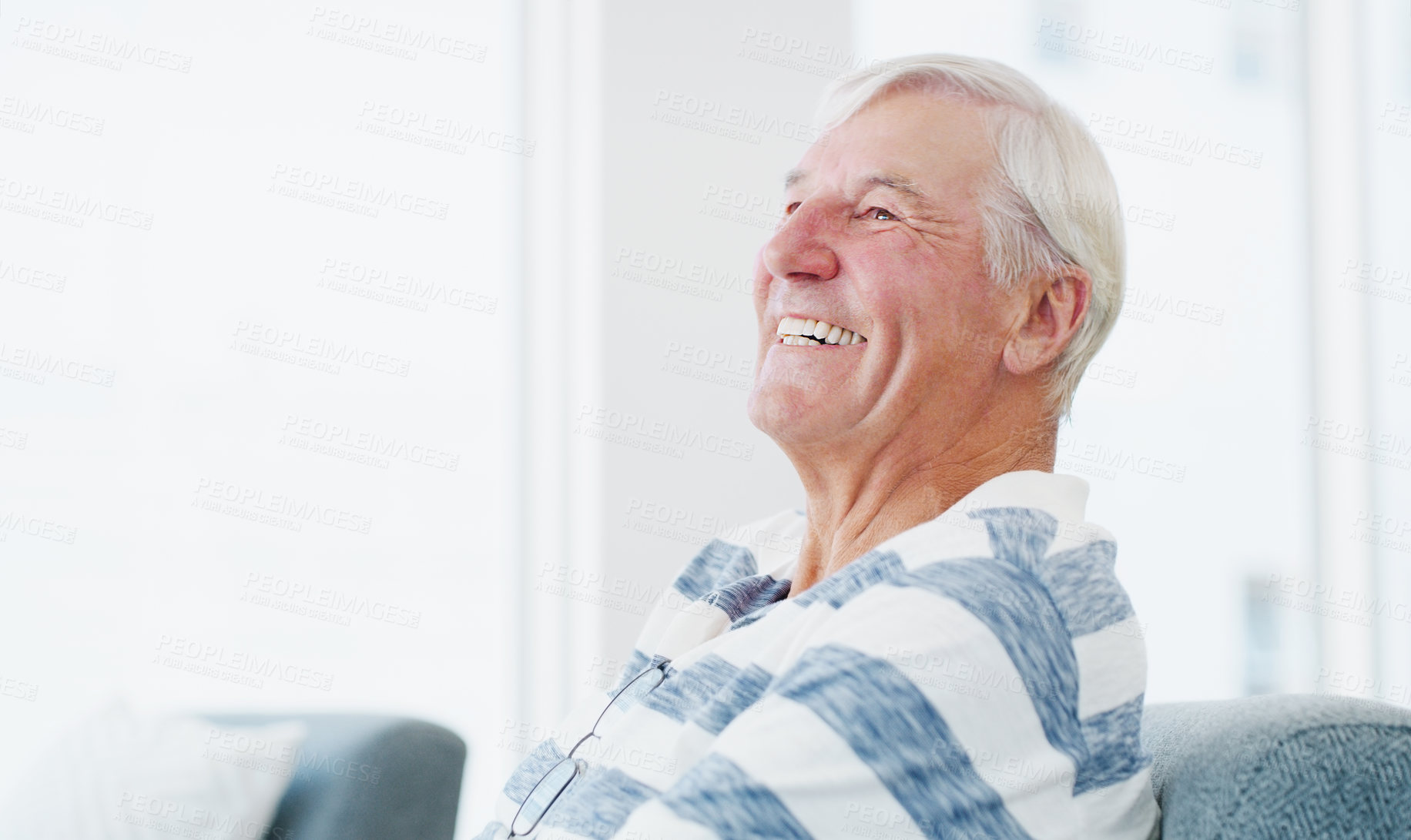 Buy stock photo Shot of a senior man relaxing on the sofa at home