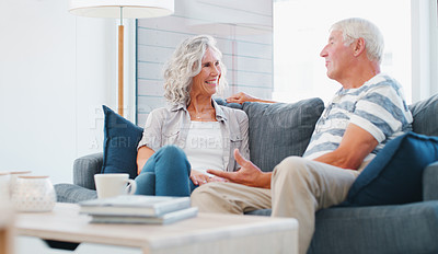 Buy stock photo Shot of a senior couple relaxing on the sofa at home
