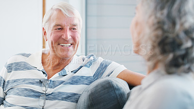 Buy stock photo Senior couple, home and happy on sofa in living room on break, bonding and relax. People, relationship and laughing for love for conversation, chat and funny memories on couch with care on retirement