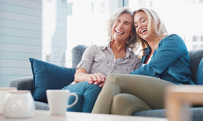 Buy stock photo Shot of a young woman spending quality time with her mother at home