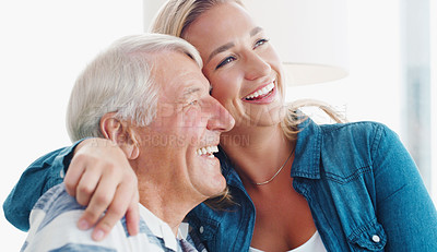 Buy stock photo Shot of a young woman spending quality time with her father at home