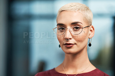 Buy stock photo Cropped portrait of an attractive young businesswoman wearing spectacles and standing alone in her office