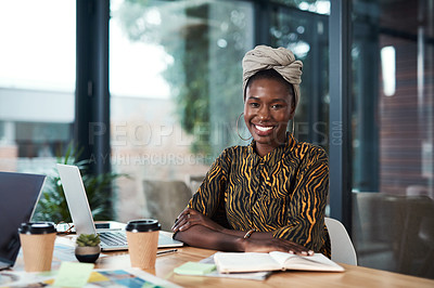 Buy stock photo Cropped portrait of an attractive young businesswoman sitting at her desk in her office with her arms folded