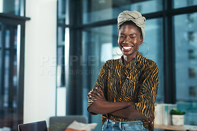 Buy stock photo Cropped portrait of an attractive young businesswoman standing alone in her office with her arms folded