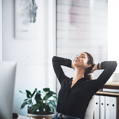 Buy stock photo Shot of a young businesswoman taking a break while working in an office
