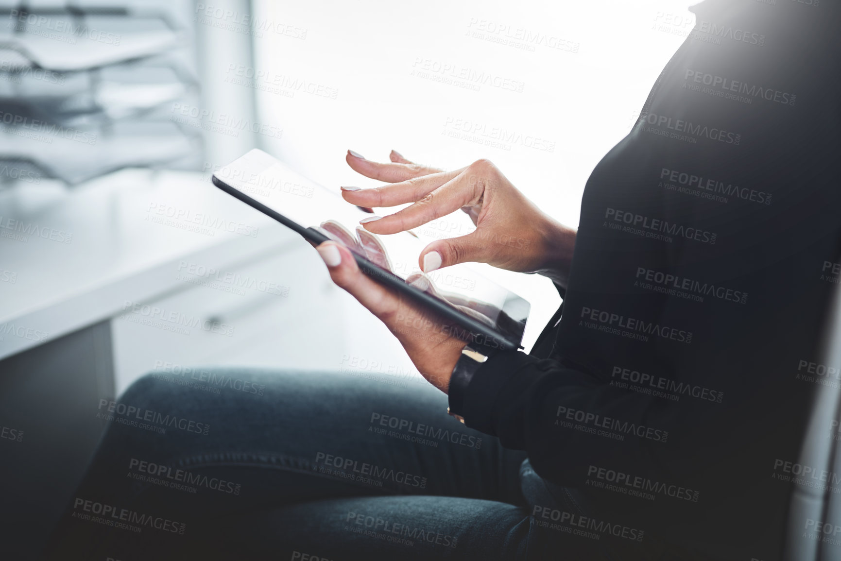 Buy stock photo Closeup shot of an unrecognisable businesswoman using a digital tablet in an office