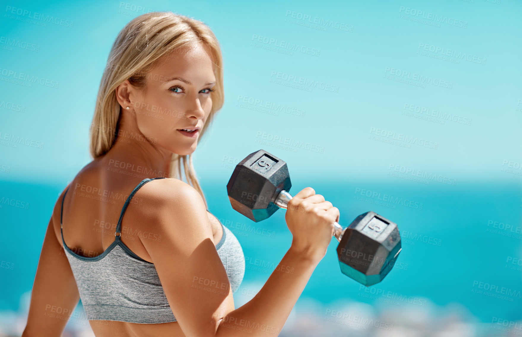 Buy stock photo Portrait, beach and woman with weights, healthy and exercise with training, wellness and fitness. Face, person and athlete with confidence, equipment and balance with dumbbells, challenge and workout