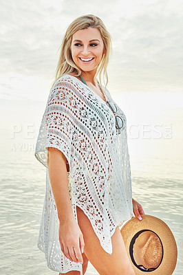 Buy stock photo Shot of a beautiful woman spending time at the beach on a sunny day