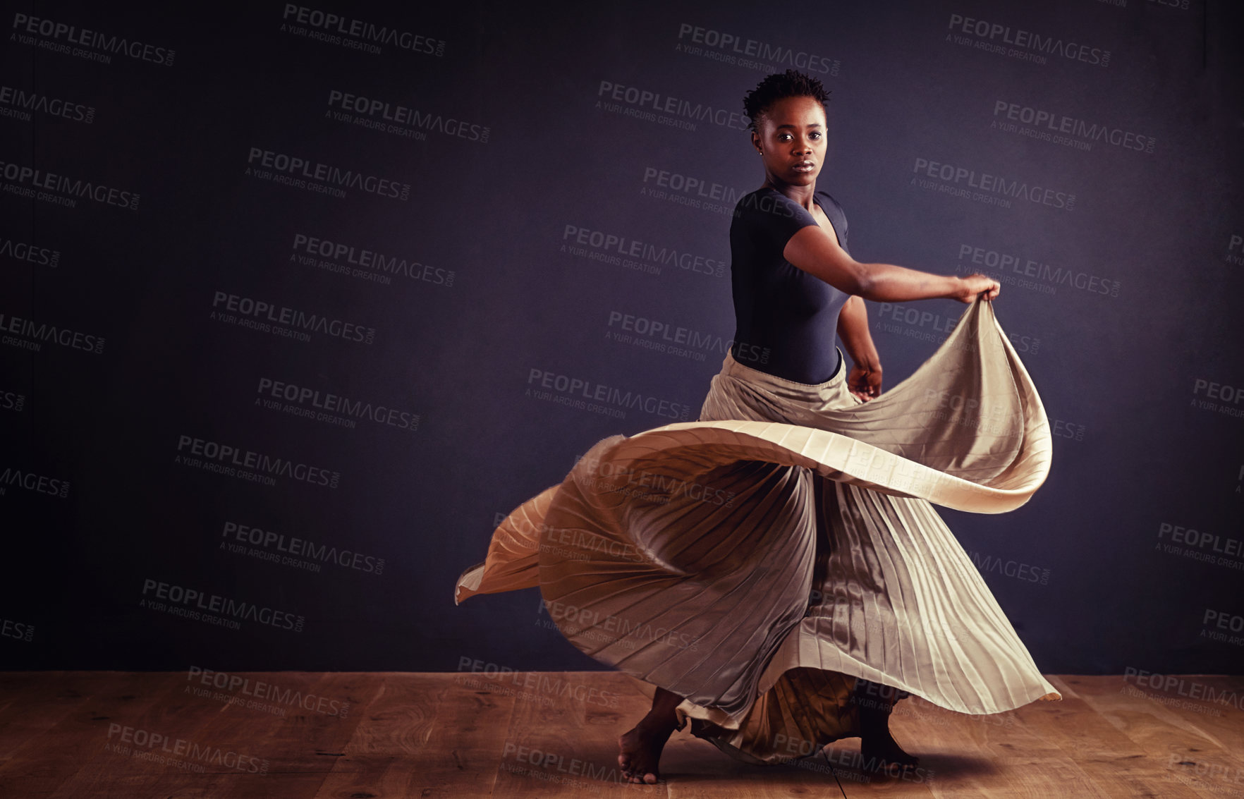 Buy stock photo Female contemporary dancer in a dramatic pose against dark background