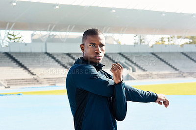 Buy stock photo African, man and stretching for sports, exercise and warm up in stadium or field for fitness. Male athlete, arms and training on track in outdoor for wellness, muscles and strong in body or mind
