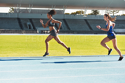Buy stock photo Woman, running and stadium track for race, competition or fitness athletics in the outdoors. Fit, active or sporty women, runner or sprinting in exercise, workout or training for healthy cardio