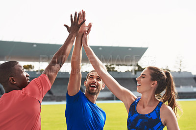 Buy stock photo Diversity, team and high five on stadium track for running, exercise or training together in athletics. Group touching hands in celebration or solidarity for exercising, run or winning in fitness