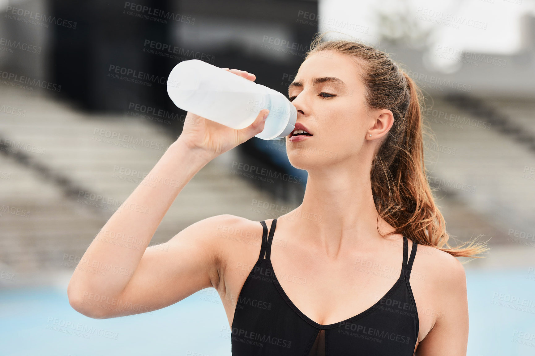 Buy stock photo Fitness, woman and runner drinking water for hydration after running exercise, workout or athletic training. Sports, nutrition or thirsty female athlete in rest with drink for natural sustainability