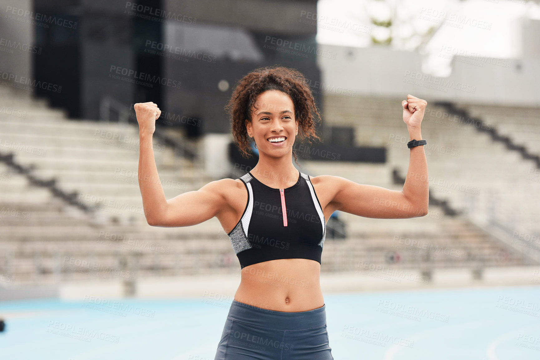 Buy stock photo Strength, win and woman runner in stadium, success or celebration for competition. Cardio, endurance and sports workout for wellness and field fitness, sprinter and fist pump for professional athlete