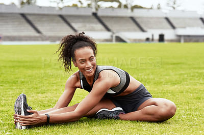 Buy stock photo Happy woman, fitness and stretching body on grass for running, exercise or workout at the stadium. Active female person or athlete in warm up leg stretch for sports training or cardio run on a field