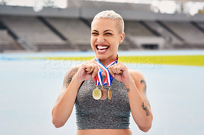 Buy stock photo Portrait, success medals and woman athlete at stadium after winning  race or sports event outdoors. Fitness, winner and female runner happy with victory, goals or target achievement on track field.