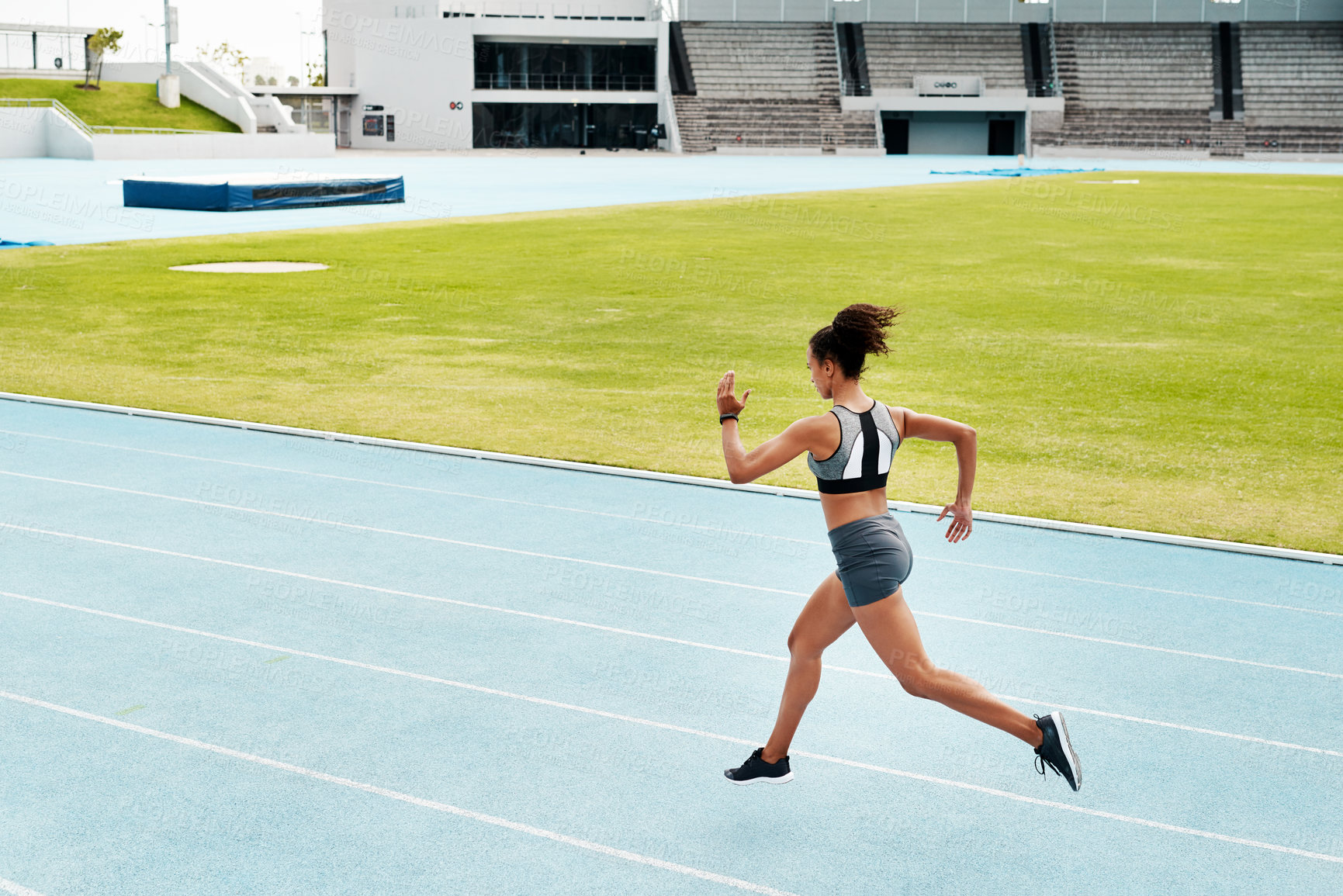 Buy stock photo Woman, fitness and running of athlete on track for exercise, cardio training or workout outdoors. Fit, active or sport female person or runner in sports run, race or athletics for wellness on stadium