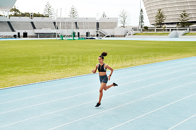 Buy stock photo Woman, fitness and running on stadium track for exercise, cardio training or workout outdoors. Fit, active or sporty female person athlete or runner in sports run, athletics or healthy wellness