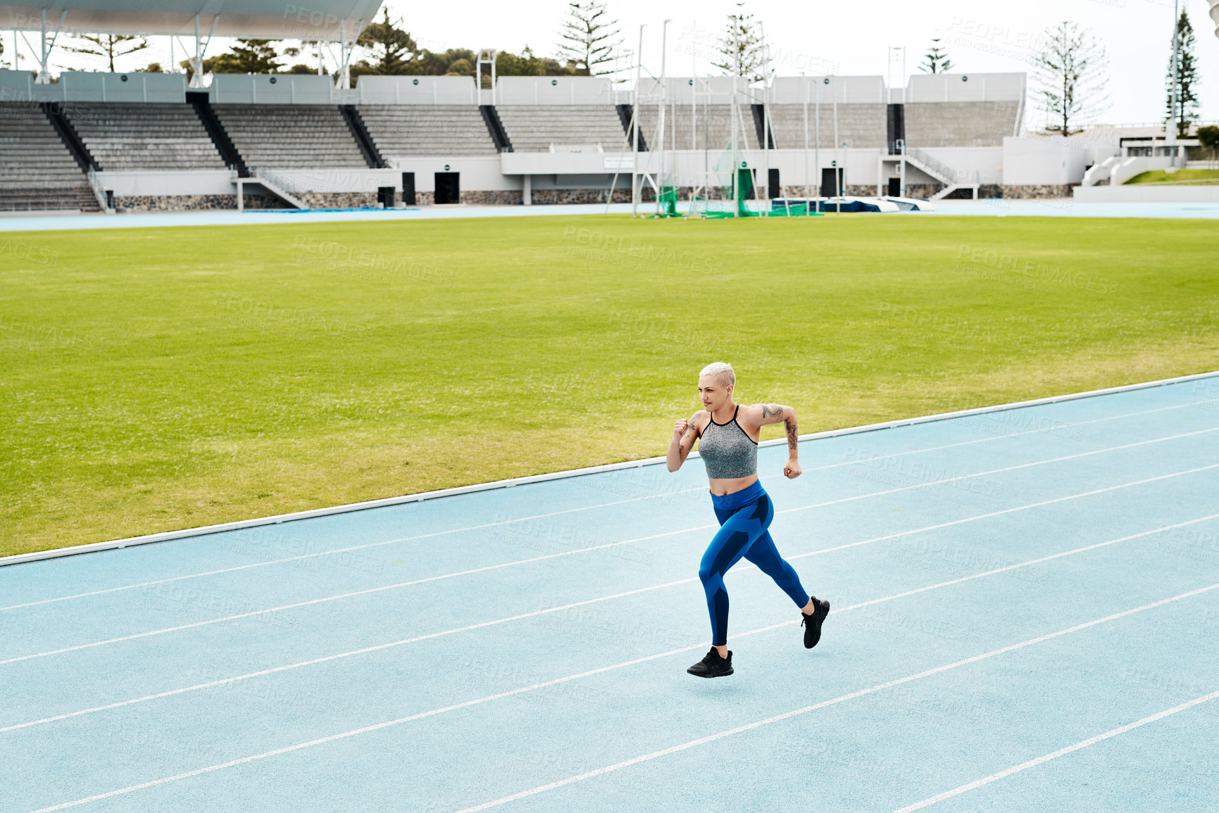 Buy stock photo Athlete, woman and running on track for fitness, exercise and training, speed and endurance for marathon race. Active, female person and sport with energy, power and activity for competition 