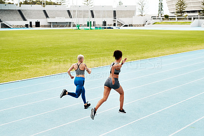 Buy stock photo Race track, fitness and women running at stadium with energy, speed and resilience training, Arena, go or marathon competition with competitive athlete runner outdoor with power, freedom or sprint