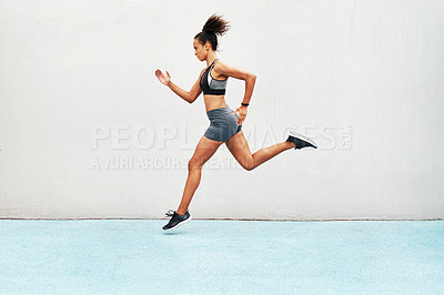 Buy stock photo Fitness, action and jump of running woman for exercise, cardio training or workout outdoors. Fit, active or sport female person or runner in sports motivation for power run or jumping on mockup space