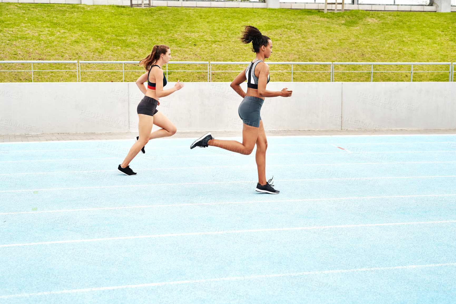 Buy stock photo Running, track and women with energy, training for competition and wellness with progress. People, runner and athletes with hobby and challenge with cardio and breathing with exercise and practice