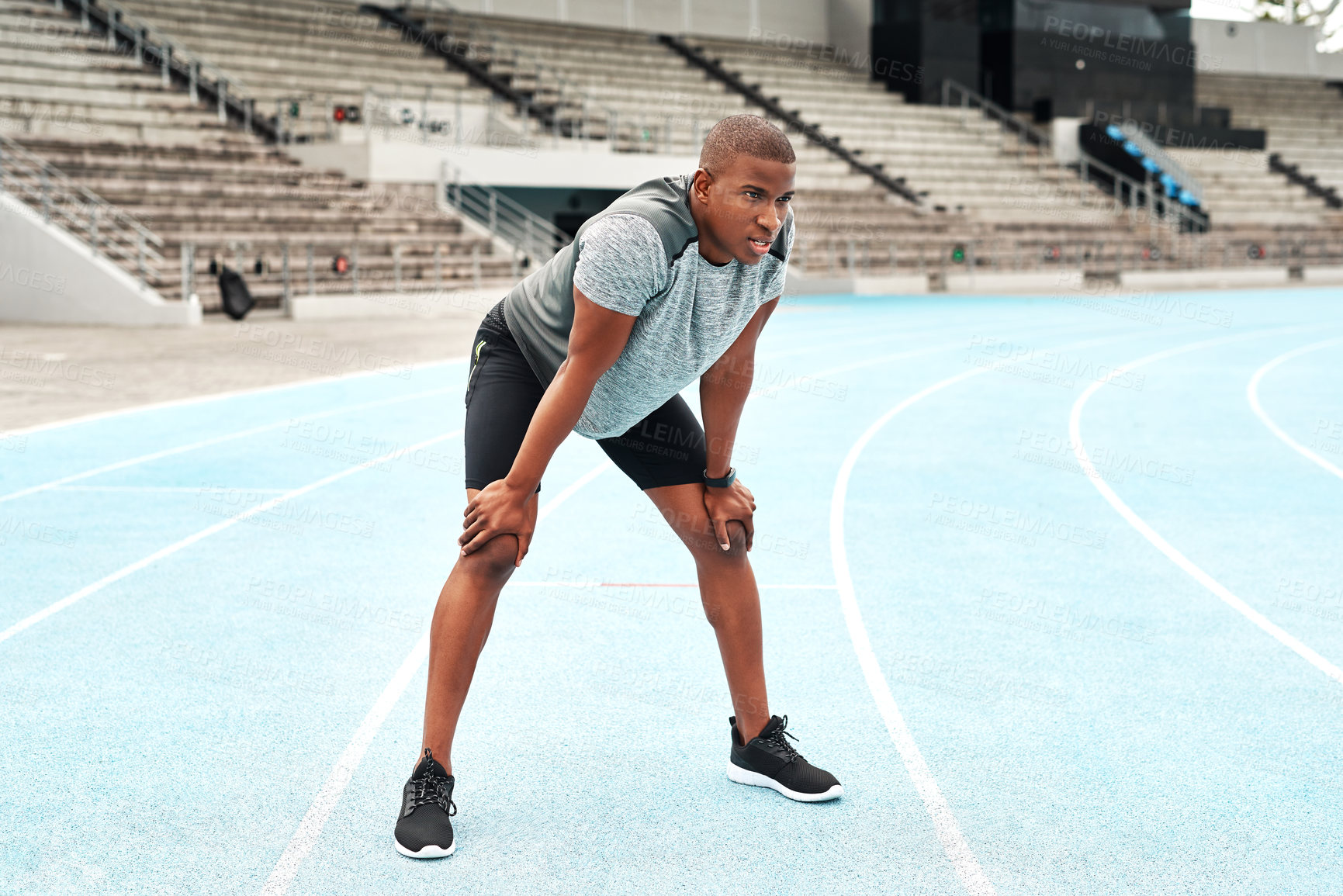 Buy stock photo Tired, black man or athlete breathing after running on track for exercise, fitness and cardio in stadium. Resting, male person or outdoor workout on marathon field for sports, health and wellness
