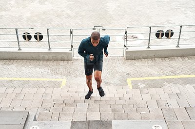 Buy stock photo Running, energy and fitness man at stadium steps for workout, resilience or training challenge. Arena, stairs and top view of runner with sports, performance or cardio exercise for marathon practice