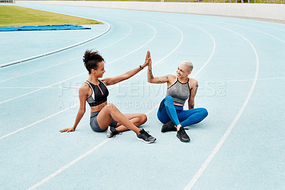 Buy stock photo Woman, team and high five on stadium track for running, workout or exercise together for goal outdoors. Sports women touching hands for support, fitness or friends in motivation, teamwork or training