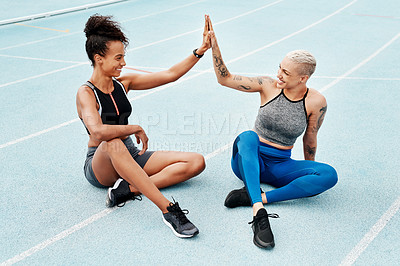 Buy stock photo Happy woman, team and high five on stadium track for running, workout or exercise goals together. Sports women touching hands in support, fitness or friends for motivation, unity or teamwork training